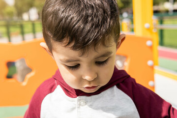 portrait child concentrated playing playground