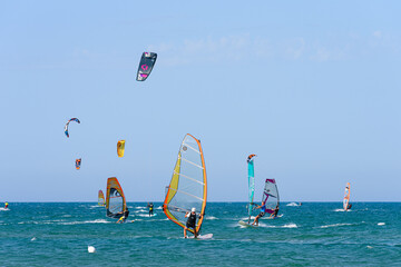 Vieste, Italy. In the sea of Vieste, near the Scialmarino beach, some people practice windsurfing...