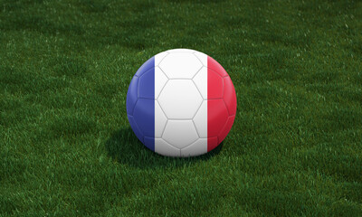 Fototapeta na wymiar Soccer ball with France flag colors at a stadium on green grasses background.