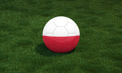 Soccer ball with Poland flag colors at a stadium on green grasses background.