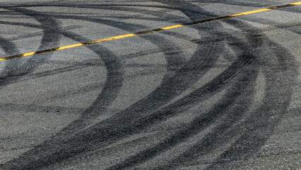 Tire track mark on asphalt tarmac road race track texture and background, Abstract background black...