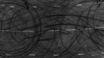 Fototapete Rund Tire track mark on asphalt tarmac road race track texture and background, Abstract background black tire tracks skid on asphalt road in racing circuit, Tire mark skid mark on asphalt road. © Darunrat