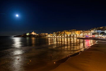 Vieste, Italy. Night view of the historic center, the promenade of Viale Marinai d'Italia and...