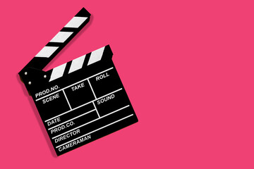Fototapeta na wymiar Movie clapperboard for shooting videos and movies on a pink background copy space