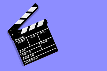 Movie clapperboard for shooting videos and movies on a lilac background copy space