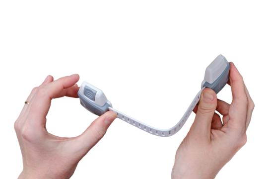 Danger for the baby to pinch the hand of the cabinet door or chest of drawers, isolated on a white background. Protect children from home furniture, kids safety