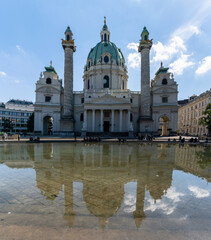 Fototapeta na wymiar view of the Karlskirche Church in downtown Vienna with reflections in the water