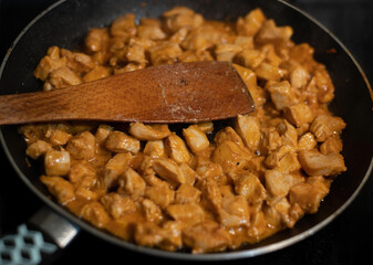 pan of fried chicken meat in the kitchen