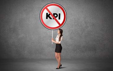 Young business person holdig traffic sign