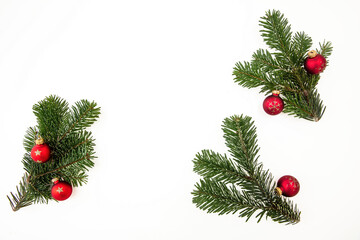 Christmas Fir twigs isolated on white. Xmas decoration, fresh pine and red bauble.