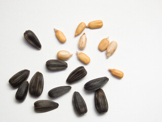 Seed of Sunflower isolated on white background. Close-up of delicious sunflower black seeds, isolated on white background