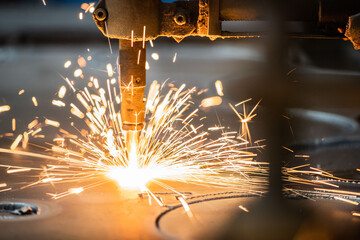 The fiber laser cutting machine cutting machine cut the metal plate. The hi-technology sheet metal...