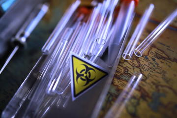 Ukrainian flag biohazard and test tubes. Assistance to Ukraine in biolaboratories. Western...