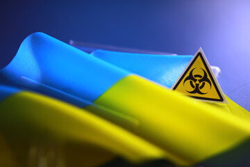 Ukrainian flag biohazard and test tubes. Assistance to Ukraine in biolaboratories. Western...