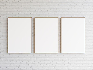 Three empty rectangle frames hanging all together on white brick wall. 3d illustration.