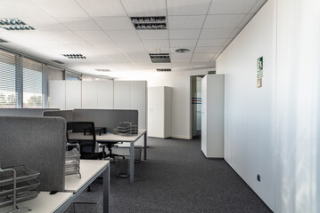Empty places for workers in contemporary coworking. Startup business office interior at new workplace. Open space office interior