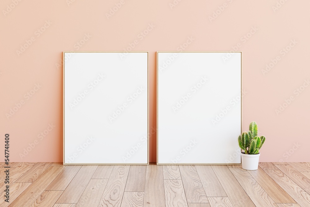 Wall mural two artwork sample frames display in bright creamy pink modern room background with cactus plant on 