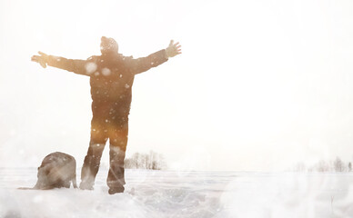 A man on a walk. Winter landscape. Tourist in winter journey.