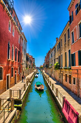 Fototapeta na wymiar Scenic canal with boats, Venice, Italy, HDR