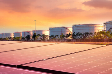 Solar panels and petroleum oil tank.The new and old of power generation