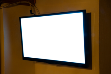 A flat TV set mounted on the wall of a room. Angled shot, blank cutout screen.
