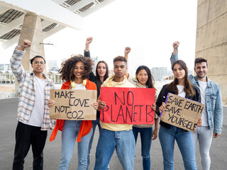 Group of multi-ethnic teenagers protesting against climate change. No planet b 