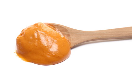 Sauce cocktail with brandy and fruity undertone in wooden spoon isolated on white