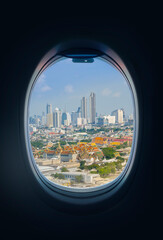Fototapeta na wymiar The view from the plane's window offers a high angle view of Bangkok.