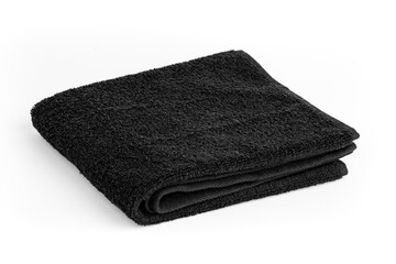 Black towel isolated on white background. Black color folded hand towel.