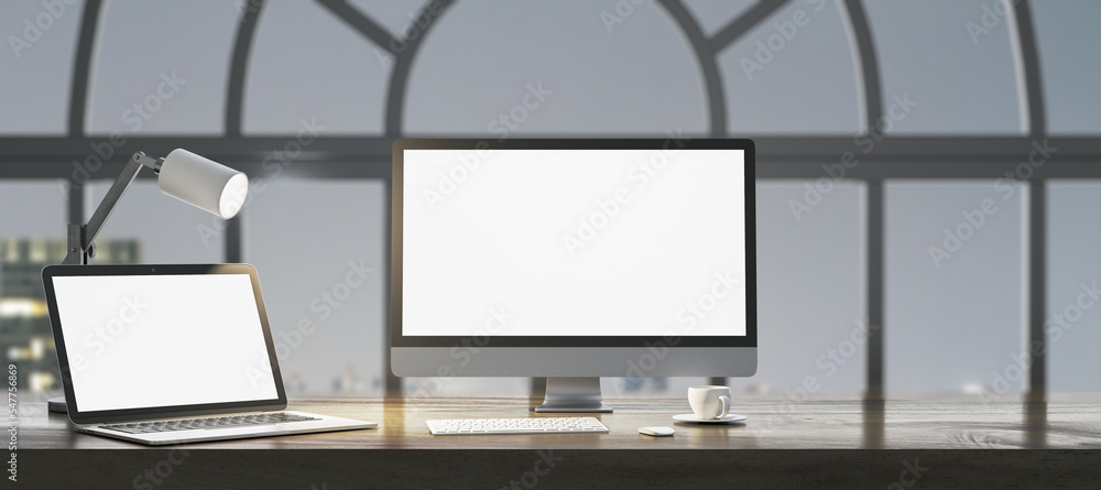 Aufkleber Close up of night designer workplace with empty white laptop computer screens, coffee cup and keyboard on wooden desktop and window with city view background. Mock up, 3D Rendering.