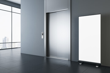 Perspective view on blank white poster on dark glossy floor in spacious modern office hall with grey wall, metallic elevator doors and city view from panoramic windows. 3D rendering, mock up