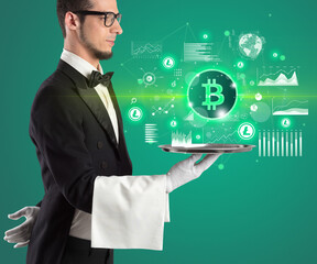 Handsome young waiter in tuxedo holding currency icons on tray