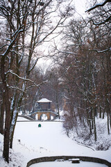 snow-covered Chinese bridge and lake in Oleksandria Park, Ukraine