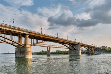 Fototapeta na wymiar Automobile Kommunalny bridge over Ob River in Novosibirsk, Russia.