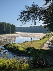 incredibly beautiful view of the river and fog in sunny day
