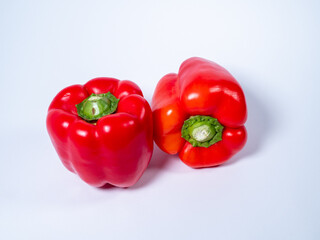 Red paprika on a white background. Red fresh pepper.