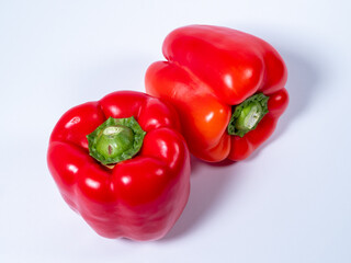 Red paprika on a white background. Red fresh pepper.