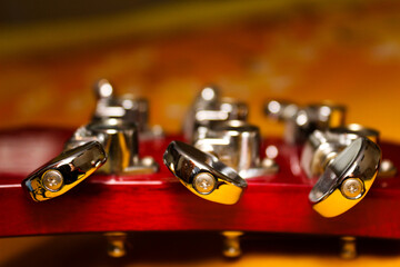 close-up of guitar tuning peg - with blurred background