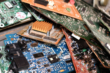 Obraz premium different Printed circuit board - microcircuits large and small lie in a chaotic order close-up
