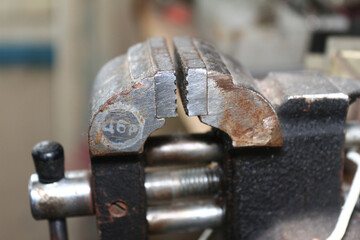 Steel small vise close-up with blurred background
