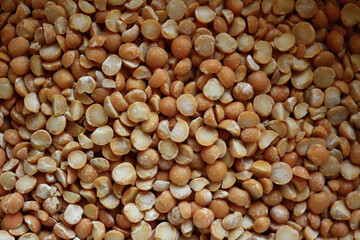 Halves of pea grains - dried - heaped in large quantities - top view - close-up