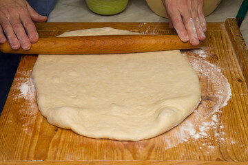 Rolling Out Dough For Pizza.