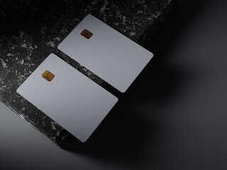 Two bank cards lie on the edge of a marble slab. Black marble and a stylish ambient scene for the presentation of the design of the bank card. 3D rendering.