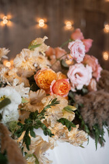 Boho flowers arrangements with fresh and dried flowers, reed, pampas grass and greenery. Wedding flower decorations.