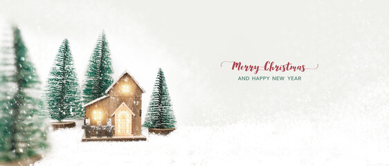 Merry Christmas and New Year festival concept, model wooden houses and pine trees between snowy...