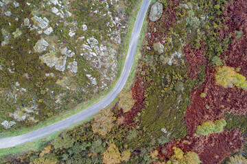 drone aerial view of a mountain road in the autumn