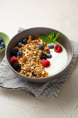 Breakfast muesli  granola with berry in bowl food on table