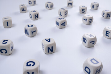  cubes or blocks word with letters randomly on a white background - the concept of , school education or self education