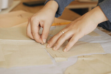 A professional fashion designer creates a new collection of clothes.