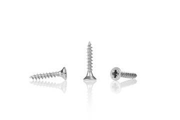 macro screw of silver color on a white background
